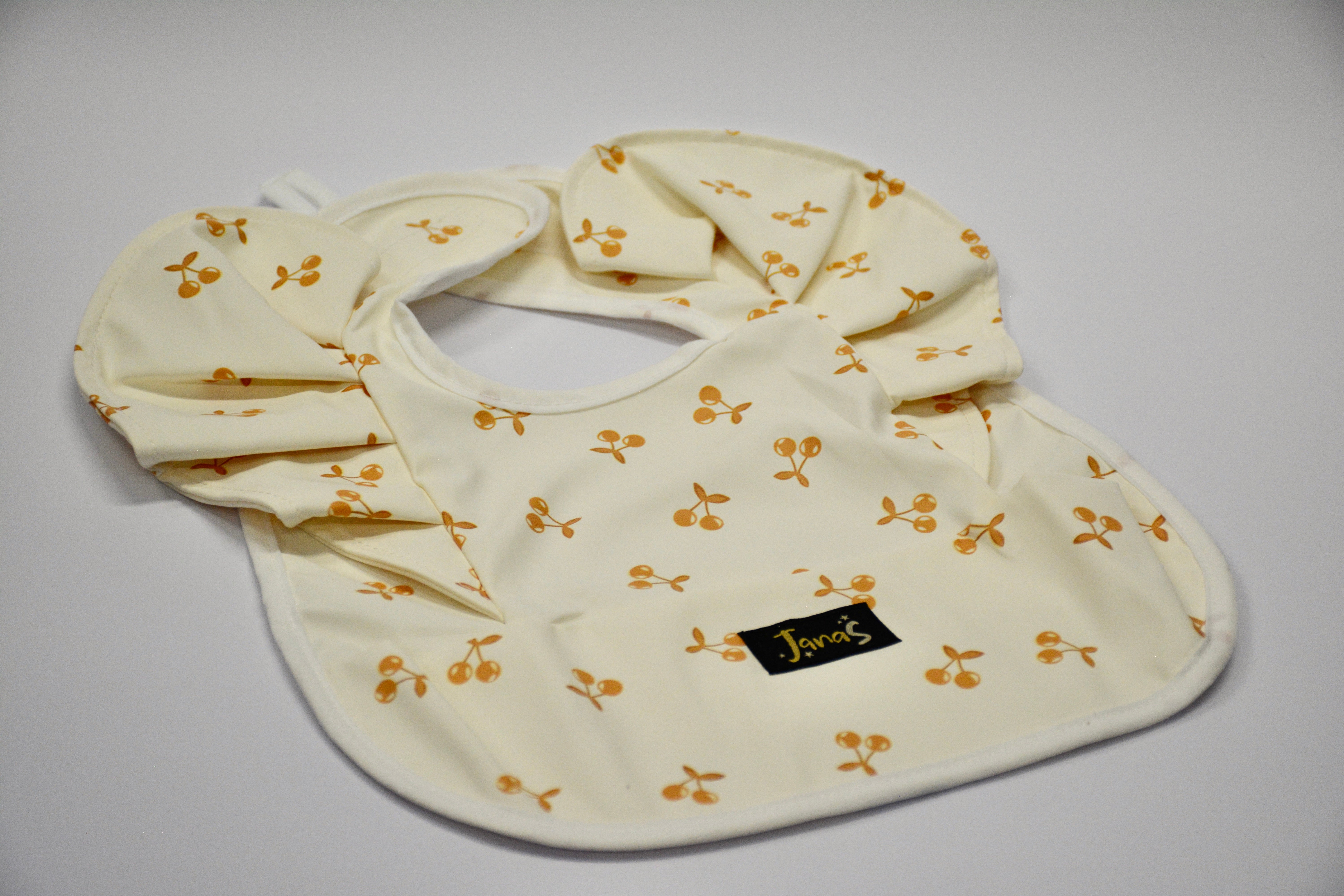 Ruffle bib - Orange Cherries
