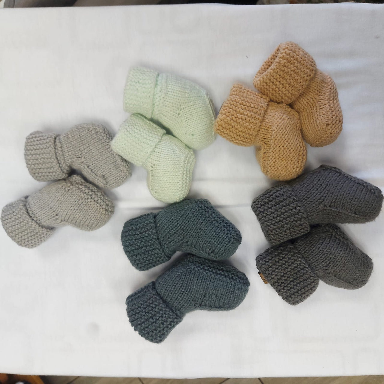 Cor.relate knitted baby booties