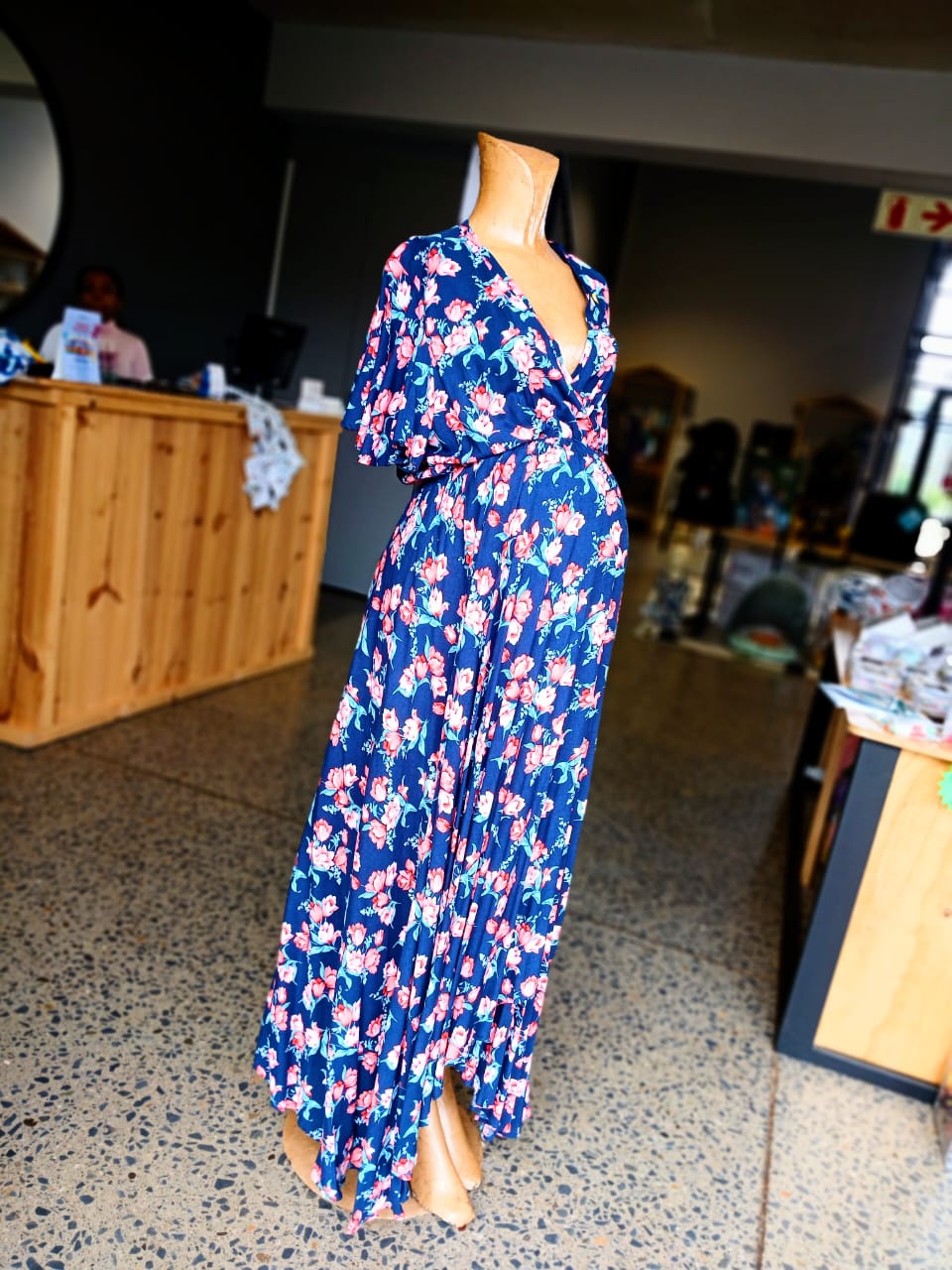 Navy and coral floral wrap over maternity dress
