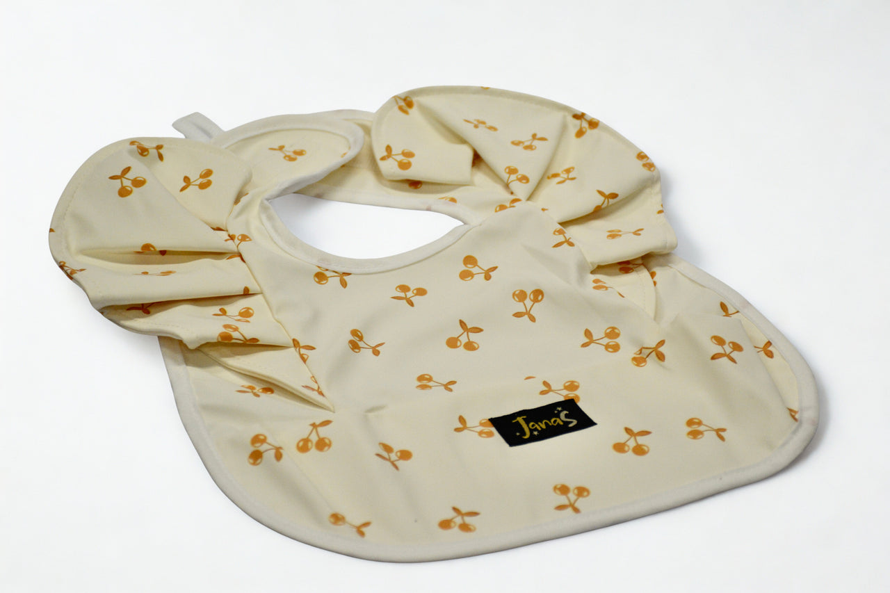 Ruffle bib - Orange Cherries